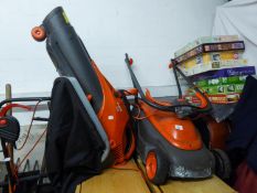 A FLYMO VENTURER 320 MOWER AND A FLYMO SCIROCCO LEAF BLOWER/VACUUM (2)