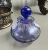 A BLUE IRIDESCENT GLASS GLOBULAR SCENT BOTTLE AND STOPPER