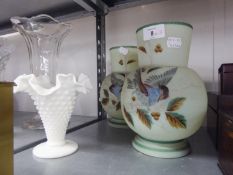 A PAIR OF VICTORIAN PALE GREEN OPAQUE GLASS GLOBULAR VASES, EACH PAINTED WITH A BIRD ON A BOUGH,