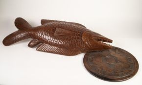 AFRICAN CARVED HARDWOOD LIFE-SIZE PLAQUE OF A CARNIVOROUS SCALY FISH, with long pectoral fin,