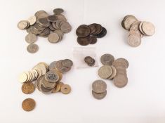 A quantity of British and foreign coins, including silver three penny pieces