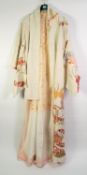 JAPANESE CREAM SILK KIMONO decorated in gold and multi-colours with flowers and foliage