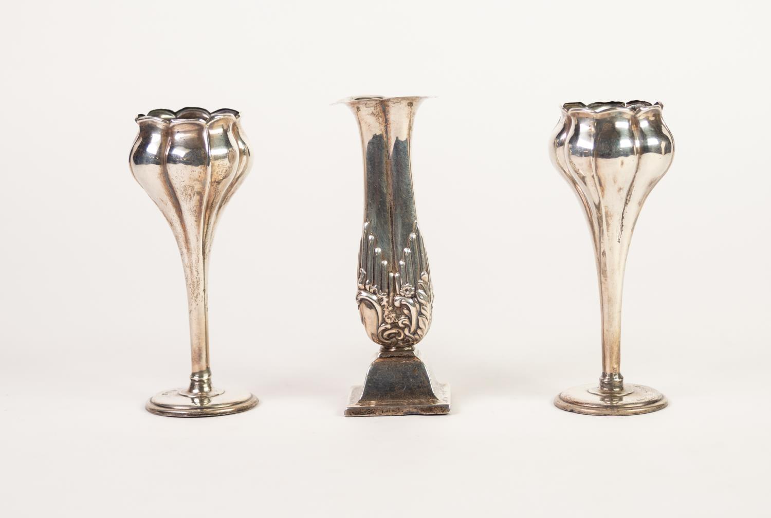 * PAIR OF SMALL EDWARDIAN SILVER TULIP PATTERN VASES with weighted circular foot, 4 1/2in (11.5cm)