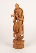 WELL-CARVED INDIAN BLOND HARDWOOD FIGURE OF HINDU GOD KRISHNA, standing playing a flute and with a