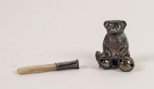 EARLY 20th CENTURY SILVER SEATED TEDDY BEAR TEETHING RATTLE, with a ball pendant from each foot