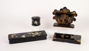 ORIENTAL BLACK LACQUERED PAPIER MACHE LETTER HOLDER, gilt printed with court figures, on an oblong