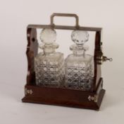 INTER-WAR YEARS MAHOGANY AND ELECTROPLATED TANTALUS with two large well-cut square glass decanters