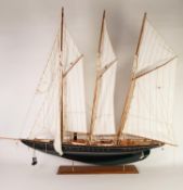 POST-WAR PROPRIETORY PAINTED WOOD MODEL OF A THREE MASTED AND STEAM POWERED SCHOONER, with fabric