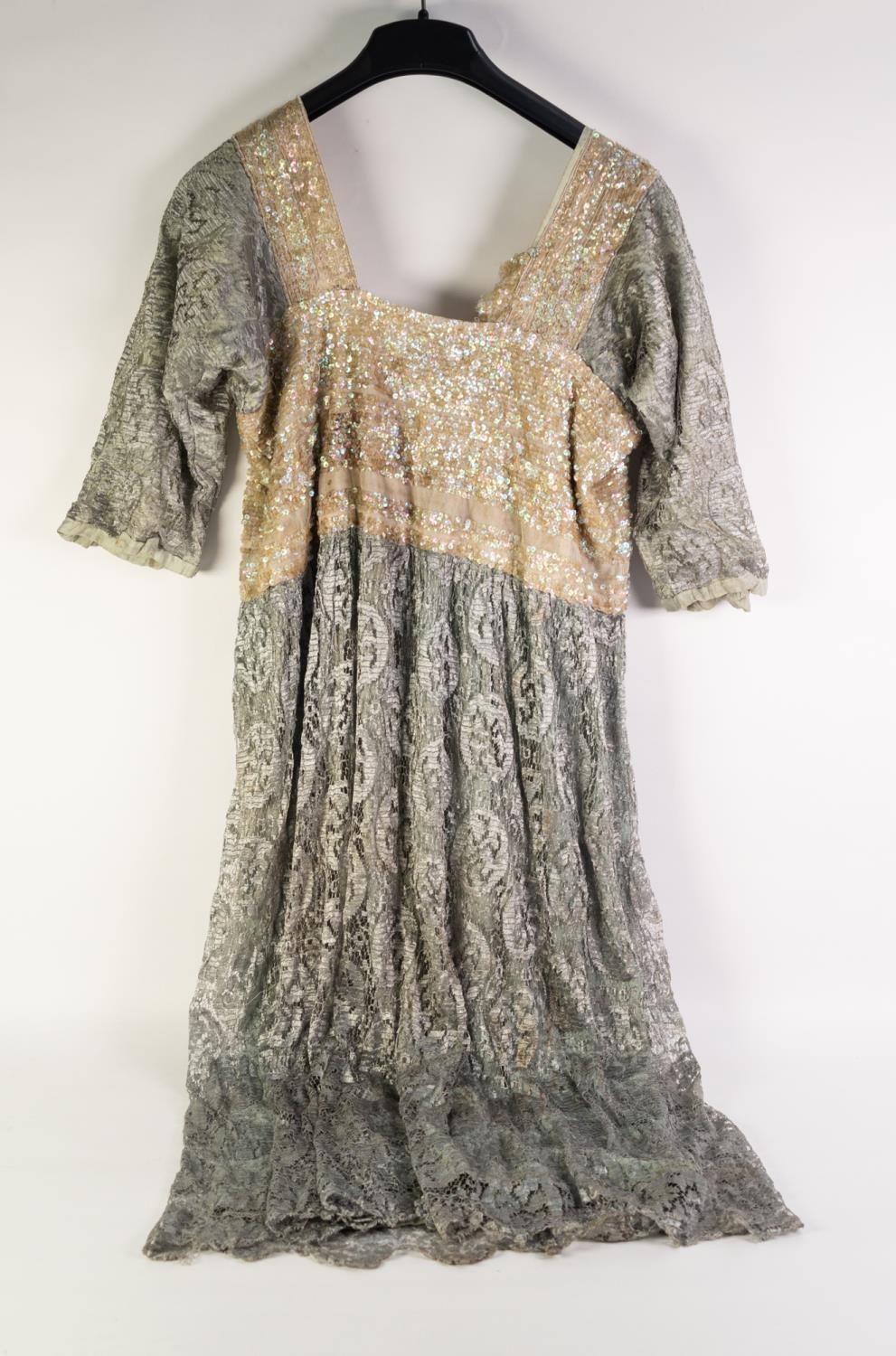 LADY'S VINTAGE EVENING DRESS with white net and sequinned bodice, pale blue net top, sleeves and