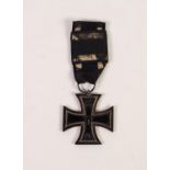 WORLD WAR I GERMAN IRON CROSS 2nd CLASS, dated 1914, reverse 1813, with ribbon