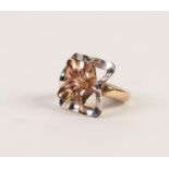 9ct THREE COLOUR GOLD DRESS RING with large square wavy two-tier top surmounted by a flower head,