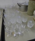 21 CUT GLASS TUMBLERS IN VARIOUS PATTERNS AND 11 CUT GLASS STEM WINES AND LIQUEUR GLASSES (32)