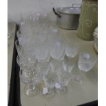 21 CUT GLASS TUMBLERS IN VARIOUS PATTERNS AND 11 CUT GLASS STEM WINES AND LIQUEUR GLASSES (32)