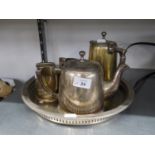 A HOTEL PLATE TEA SERVICE OF FOUR PIECES, ON AN ELECTROPLATE CIRCULAR, GALLERY TRAY