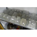 A LARGE COLLECTION OF MOULDED GLASS OBLONG CHEESE OR BUTTER DISHES  (18)