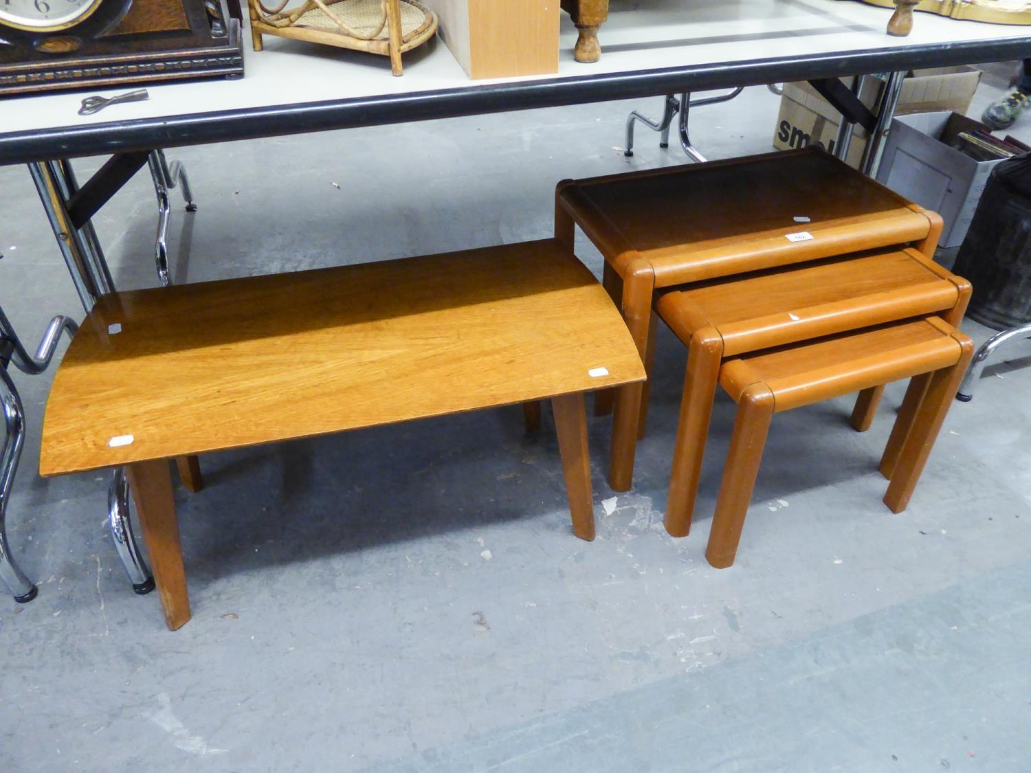 A NEST OF THREE TEAK OBLONG COFFEE TABLES, ON STRAIGHT LEGS AND A 1960'S OAK OBLONG COFFEE TABLE, ON