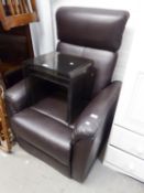 A BLACK LEATHER CLOTH COVERED ELECTRONIC TIPPING AND RECLINING EASY ARMCHAIR