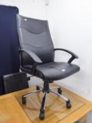 AN EXECUTIVE HIGH-BACKED, REVOLVING OFFICE ARMCHAIR, COVERED IN BLACK HIDE, ON FIVE SPUR BRIGHT