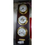 A SHIP?S TYPE CLOCK, BAROMETER AND THERMOMETER, ON MAHOGANY PANEL