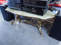 A GILT METAL COFFEE TABLE WITH SHAPED OVAL GREEN ONYX TOP