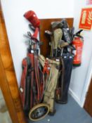 THREE BAGS OF METAL SHAFTED GOLF CLUBS AND A FOLDING GOLF TROLLEY WITH SEAT