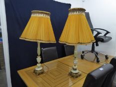 A PAIR OF  GILT METAL AND ONYX TABLE LAMPS AND SHADES