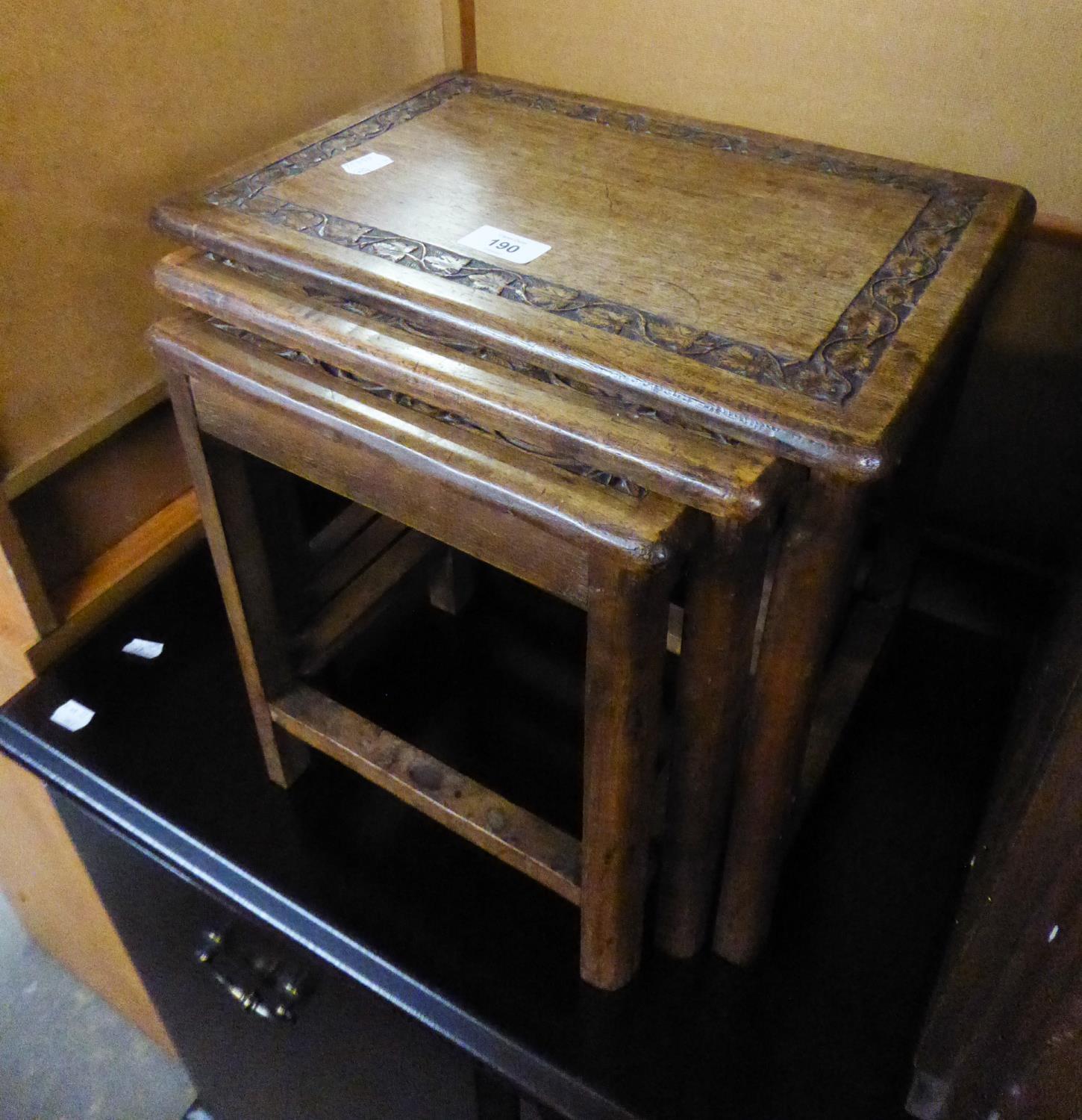 NEST OF THREE MAHOGANY OBLONG COFFEE TABLE WITH FOLIATE SCROLL CARVED BANDED BORDERS, ON STRAIGHT