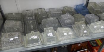 A LARGE COLLECTION OF MOULDED GLASS OBLONG CHEESE OR BUTTER DISHES (18)