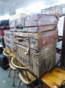 A WICKER STAGE COSTUME TRUNK AND A LARGE LEATHER SUITCASE (2)