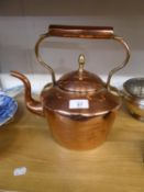 AN ANTIQUE COPPER KETTLE