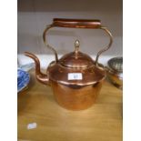 AN ANTIQUE COPPER KETTLE