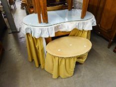 AN UNPOLISHED WOOD KIDNEY SHAPED DRESSING TABLE, WITH CURTAIN FALL AND LOOSE PLATE GLASS TOP AND