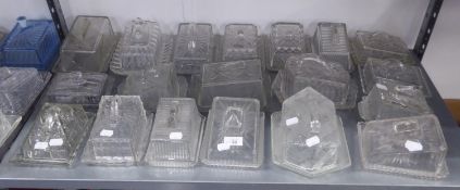 A LARGE COLLECTION OF MOULDED GLASS OBLONG CHEESE OR BUTTER DISHES AND COVERS (19)