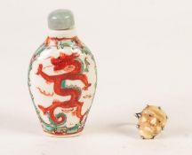 ORIENTAL OVOID PORCELAIN SNUFF BOTTLE, painted with orange dragons and the stopper; EARLY 20th