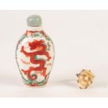 ORIENTAL OVOID PORCELAIN SNUFF BOTTLE, painted with orange dragons and the stopper; EARLY 20th