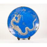 20th CENTURY JAPANESE PORCELAIN LARGE CIRCULAR PLAQUE, sky blue and having embossed white wryting