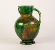 A LATE VICTORIAN WEDGWOOD DORIC POTTERY MOTTLED GREEN GLAZED JUG, with square section loop handle