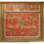 FRAMED AND GLAZED COMPOSITE OF 19th CENTURY CHINESE EMBROIDERED SILK MANDARIN ROBE PIECES, the upper