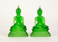 PAIR OF EARLY 20th CENTURY SIAMESE MOULDED TRANSLUSCENT GREEN GLASS FIGURES OF A BUDDHA, depicted