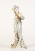 LLADRO, SPANISH, PORCELAIN FIGURE OF A CLOWN WEARING CHECK TROUSERS, dragging a small dog by its