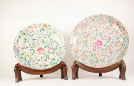 TWO LARGE CHINESE PORCELAIN CIRCULAR PLAQUES wih pale famille rose floral decoration, 16in and 14