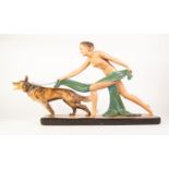 ART DECO PAINTED PLASTER GROUP OF A NAKED FEMALE FIGURE WITH ALSATIAN DOG, painted in natural