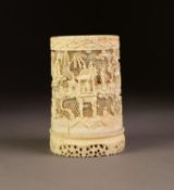 AN INTRICATELY CARVED AND PIERCED CHINESE CANTON IVORY CYLINDRICAL TUSK SECTION VASE, with
