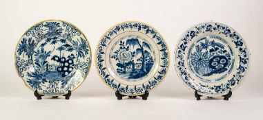 THREE 19th CENTURY DUTCH DELFT TIN GLAZED EARTHENWARE COBALT BLUE PAINTED PLATES, each 9in (23cm) (