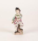 A SMALL EARLY TWENTIETH CENTURY GERMAN, PORCELAIN FIGURE  of a boy in tri-corn hat and floral