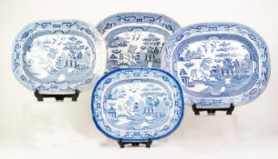 MATCHED GRADUATED SET OF FOUR BLUE AND WHITE WILLOW PATTERN POTTERY MEAT PLATES, each of rounded