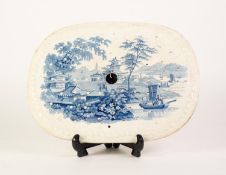 NINETEENTH CENTURY BLUE AND WHITE POTTERY DRAINER, of rounded oblong form with moulded border,