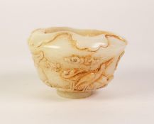 A CHINESE PALE CELADON JADE BOWL of ogee form carved in shallow relief with cranes standing and in