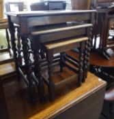 A NEST OF THREE  OAK OBLONG COFFEE TABLES, ON SPIRAL LEGS WITH PLAIN STRETCHER RAILS