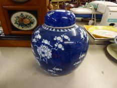 NANKIN BLUE AND WHITE GINGER JAR AND DOMED COVER, PAINTED IN BLUE AND WHITE WITH PRUNUS BLOSSOMS,